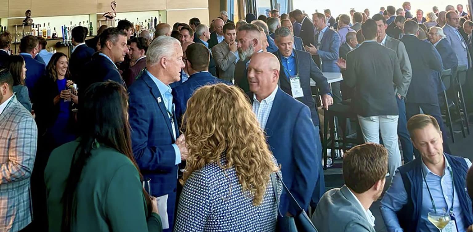 Businesspeople conversing at the 2024 ACG Great Lakes Capital Connection© Conference